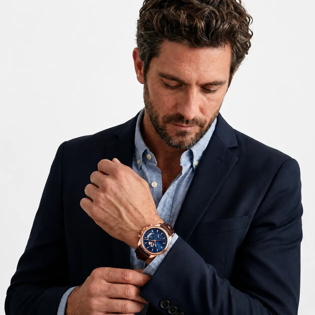 Meridian Atlantic Rose worn on the wrist with a tailored navy jacket