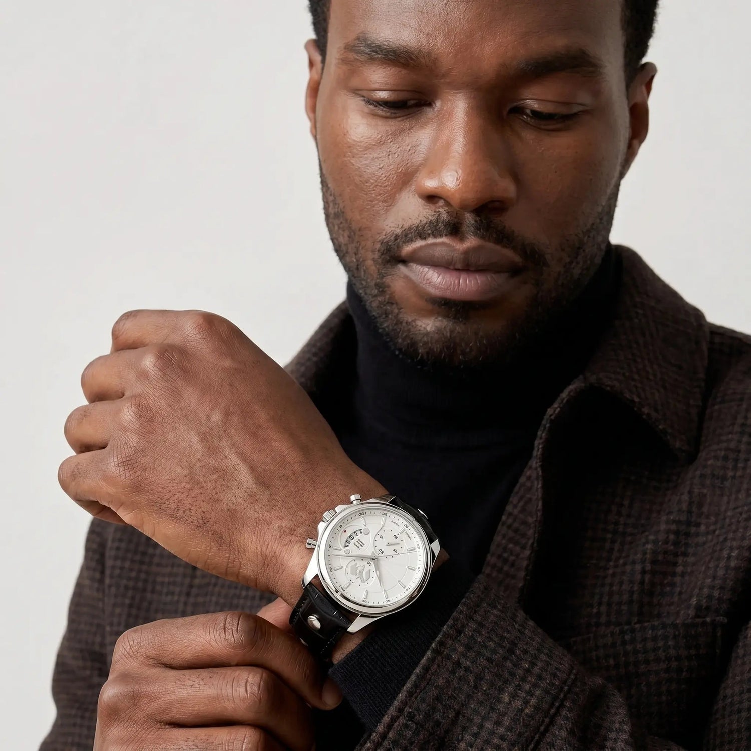 Close-up of the Meridian Ivory Steel white dial and steel case